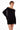Vestido corto negro BLKMBA con mangas murciélago y escote asimétrico estilo disco.